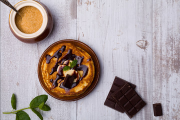 Delicious pancakes with bananas and chocolate.