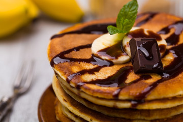 Delicious pancakes with bananas and chocolate.