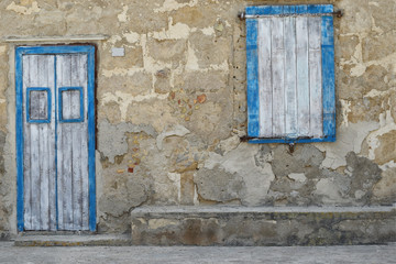 Mediterranean colors. Facade details. Door and windows painted in blue