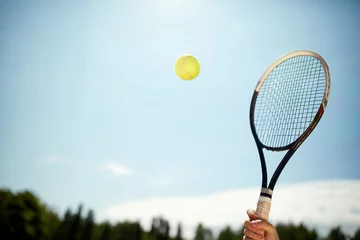 Tuinposter Close up van tennisracket en bal © luckybusiness
