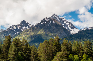 mountain peaks against the blue sky