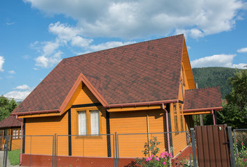 Beautiful small house over blue sky