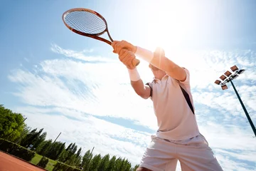 Zelfklevend Fotobehang Sportsman on tennis court © luckybusiness