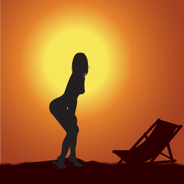 Silhouette of the naked girl at sunset