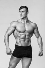 Sexy muscular man fitness model in underwear. Strong male naked torso abs