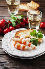Italian antipasto with shripms and white wine
