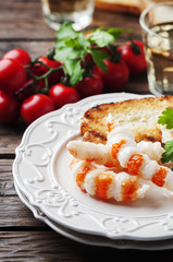 Italian antipasto with shripms and white wine
