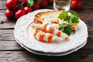 Italian antipasto with shripms and white wine