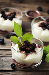 Fototapeta na wymiar Homemade dessert with blackberry and cream