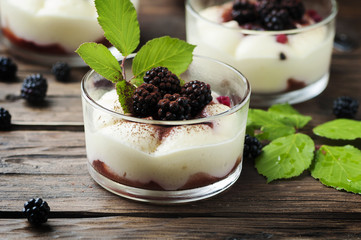 Homemade dessert with blackberry and cream