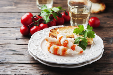 Italian antipasto with shripms and white wine