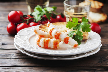Italian antipasto with shripms and white wine