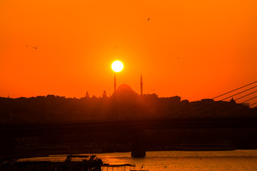 sunset and silhouette of a mosque in Istanbul