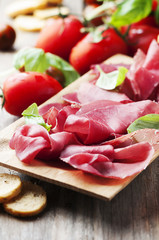 Appetizer with italian bresaola and tomato