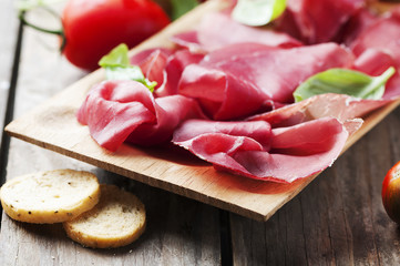 Appetizer with italian bresaola and tomato