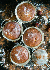 Chocolate muffins in paper forms