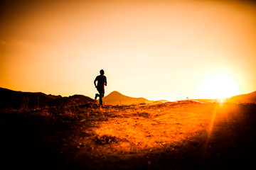 silhouette of man in the mountainous area athletes