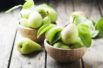 Sweet green pears on the wooden table