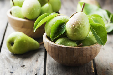 Sweet green pears on the wooden table