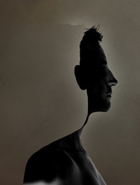Fototapeta surrealistic portrait of a young man with cut out profile