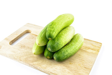 Cucumber on cutting board on white background
