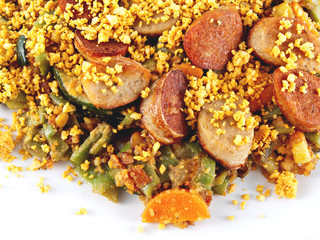 sausage-flavored tofu with vegetables and curry-spiced ground peanuts