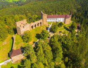 Fototapeta na wymiar Gothic castle Velhartice in National Park Sumava. Aerial view to medieval monument in Czech Republic. European landmarks from above. 