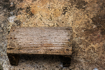 old wooden seats  on cement background