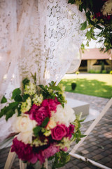 Wedding ceremony decoration. Table flowers decor. wedding arch decorated with flowers.