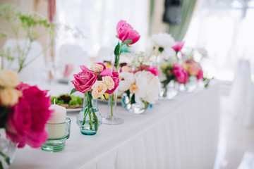 Wedding ceremony decoration. Table flowers decor. wedding arch decorated with flowers.