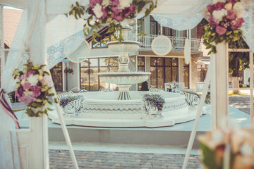Wedding ceremony decoration. Table flowers decor. wedding arch decorated with flowers.