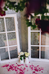 Wedding ceremony decoration. Table flowers decor. wedding arch decorated with flowers.