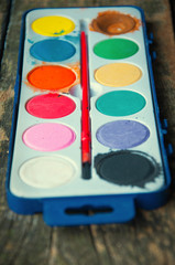 School paints on wooden background