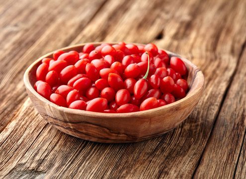 Goji berries in a wooden plate
