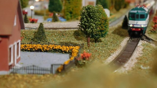 Model train passing by on a diorama
