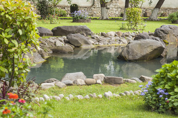 Landscaped garden, artificial lake, pond