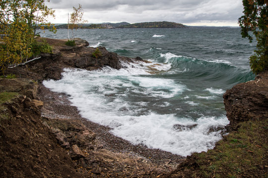 Lake Superior Coast. The shore of Lake Superior as waves crash on the beach. Presque Isle Park. Marquette, Michigan.