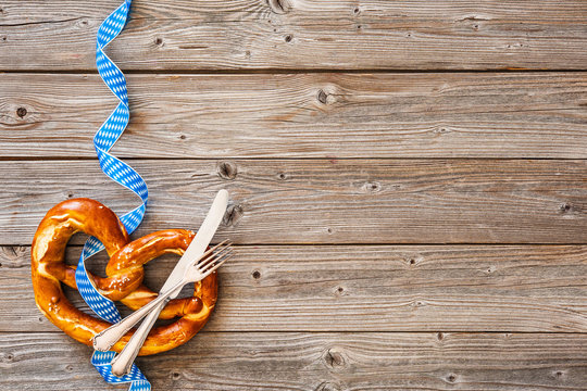 Bavarian pretzel with ribbon and silverware