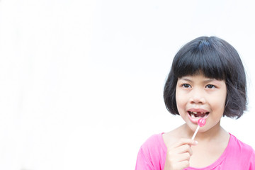little girl and broken teeth with sweet candy on white bacground