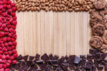 Sweet background consisted of rapsberry, chocolate, nuts and cookies