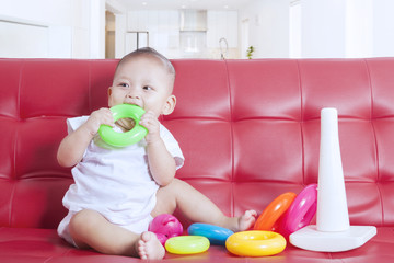 Baby plays colorful toys