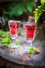 Sweet liqueur with wild strawberry and alcohol
