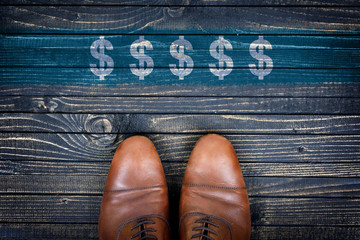 Dollar sign message and business shoes