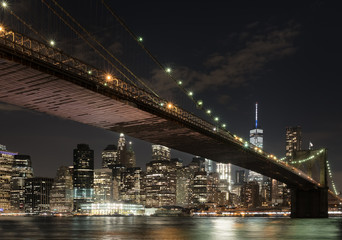 The downtown Mahnattan skyline and the Brooklyn Bridge at night