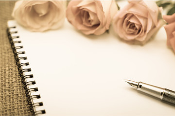 Diary note with rose on gunny bag (Organizer ,agenda, book, diar