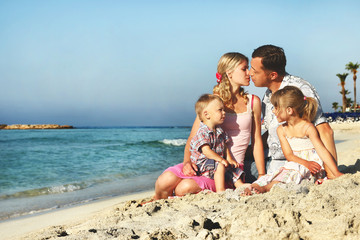 family on the shore of the sea