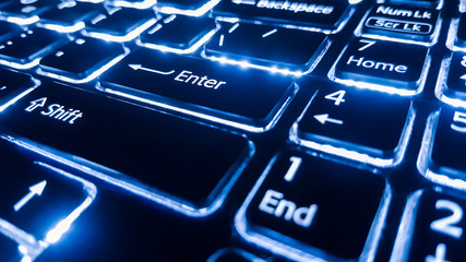 Neon keyboard with enter button. Focus on the  .
