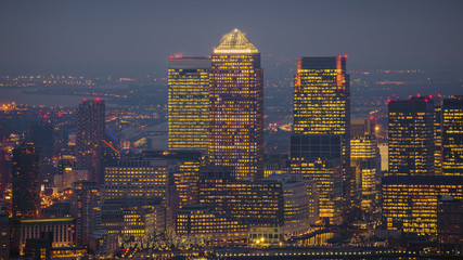 London, England - Skyline view of the skyscrapers of Canary Wharf, the leading business district of London at blue hour