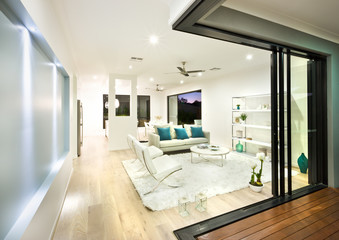 Modern living room illuminated at night with lights