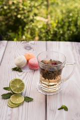Colorful macaron with a cup of tea, mint